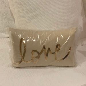Love pillow with embroidered gold sequins